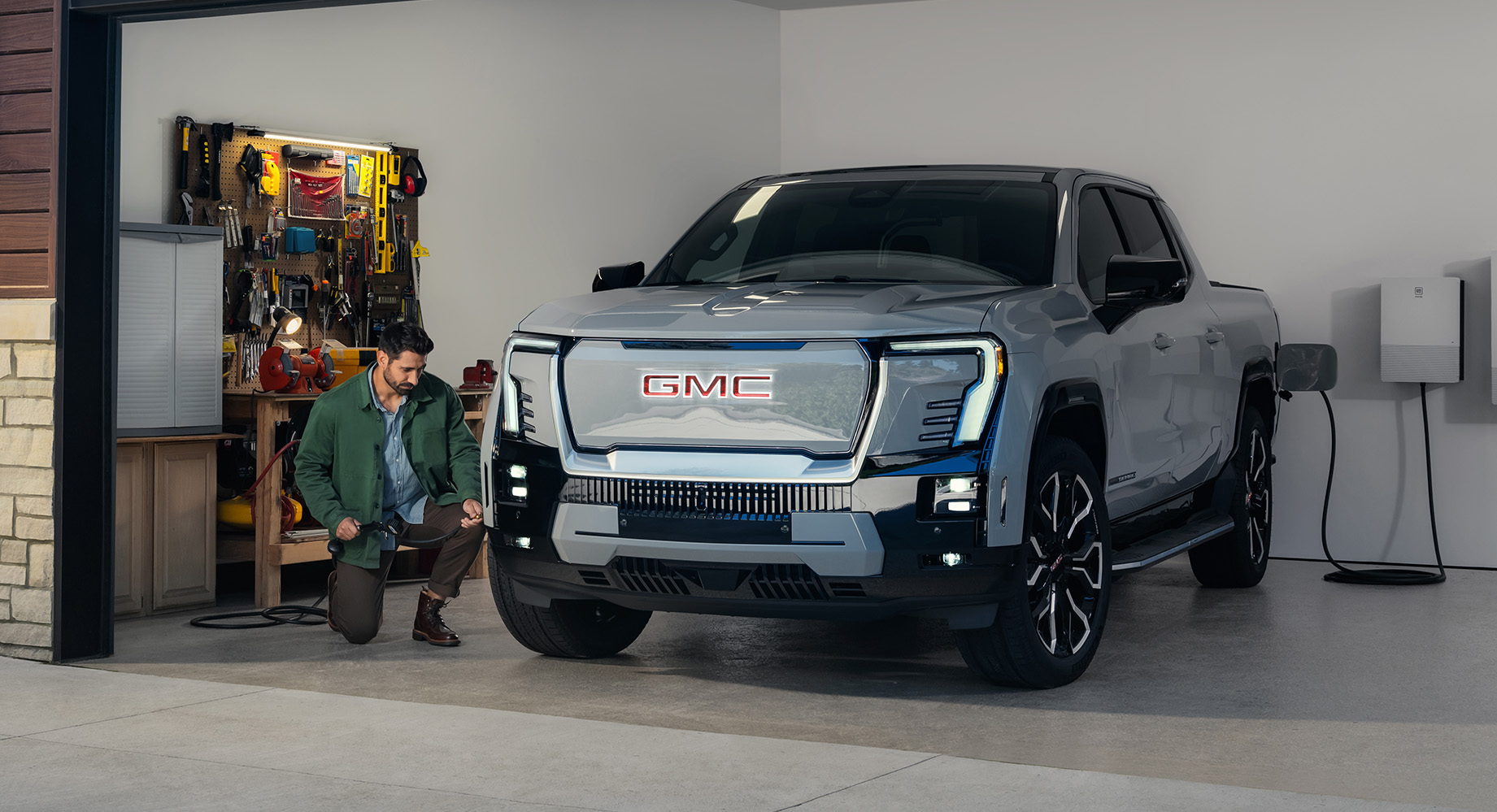 Grey GMC Sierra EV parked in a garage
