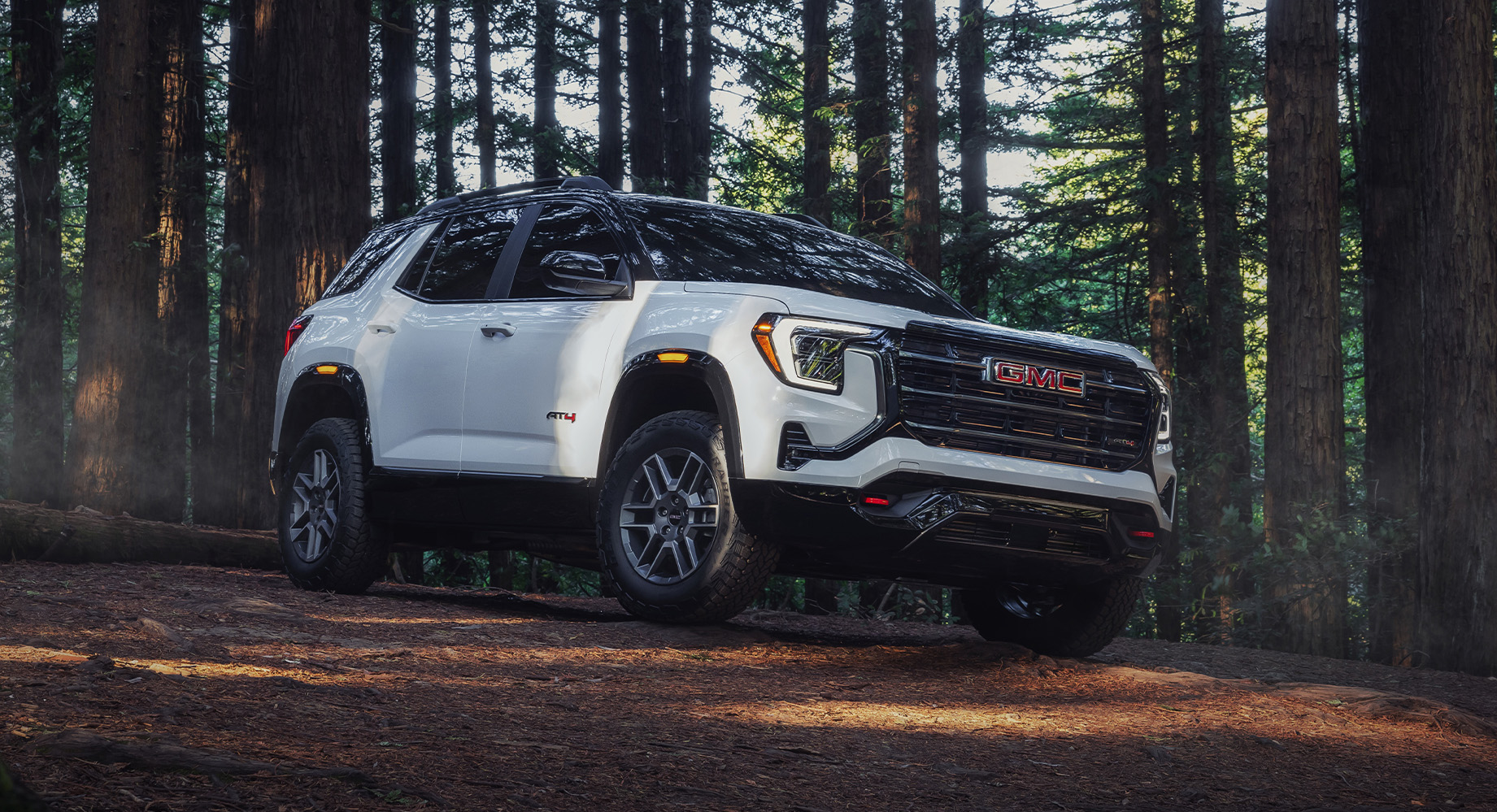 Grey GMC Sierra EV parked in a garage
