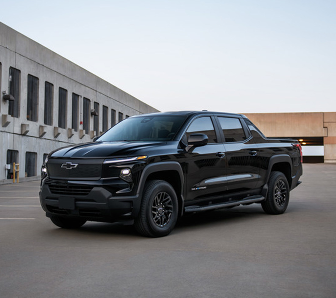 Black Chevrolet Silverado EV parked in a parking lot