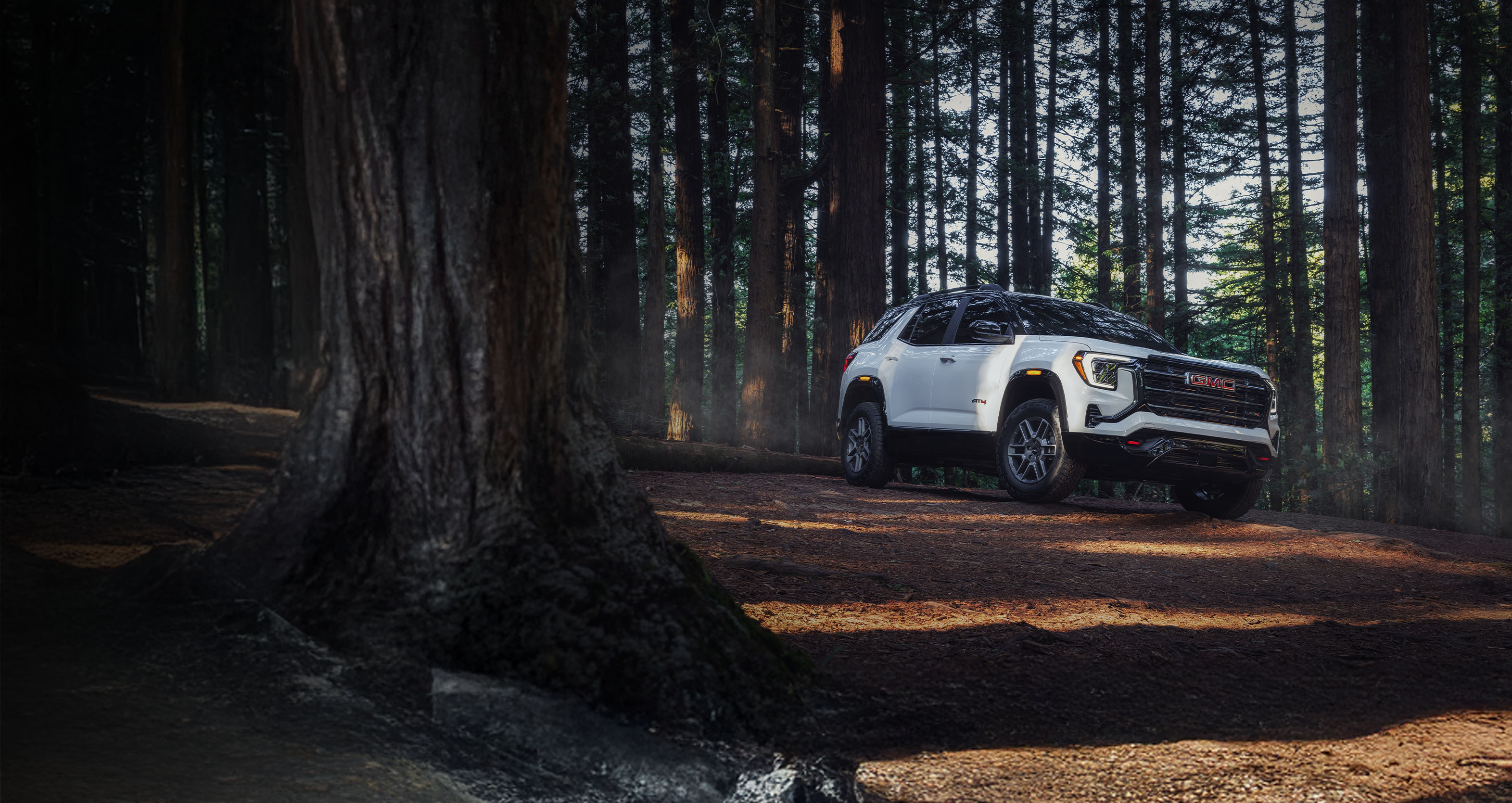 Grey GMC Sierra EV parked in a garage
