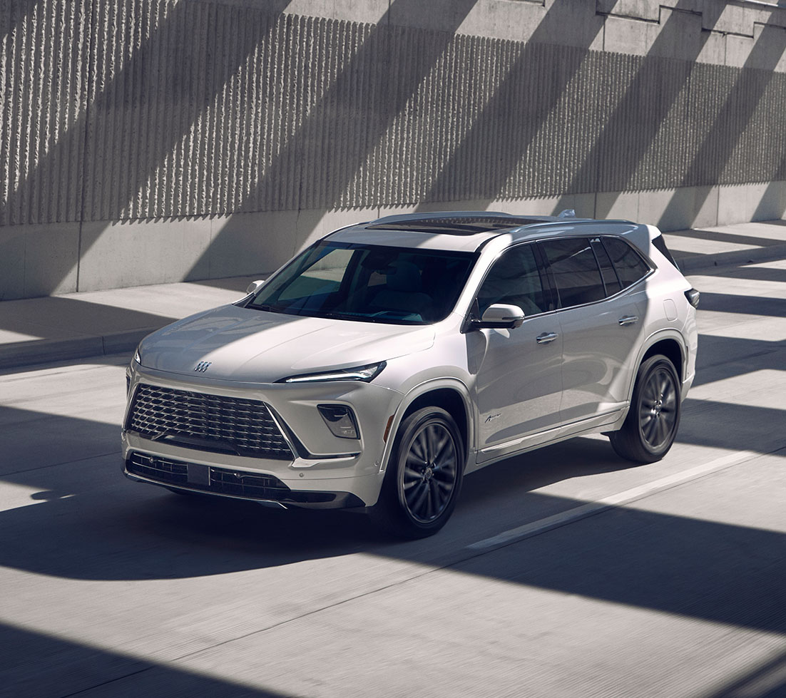 White Buick Enclave is driving through a tunnel